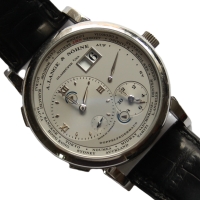 A. Lange & Söhne Lange 1 Zeitzone 950er Platin 116.025 Herrenuhr B&P